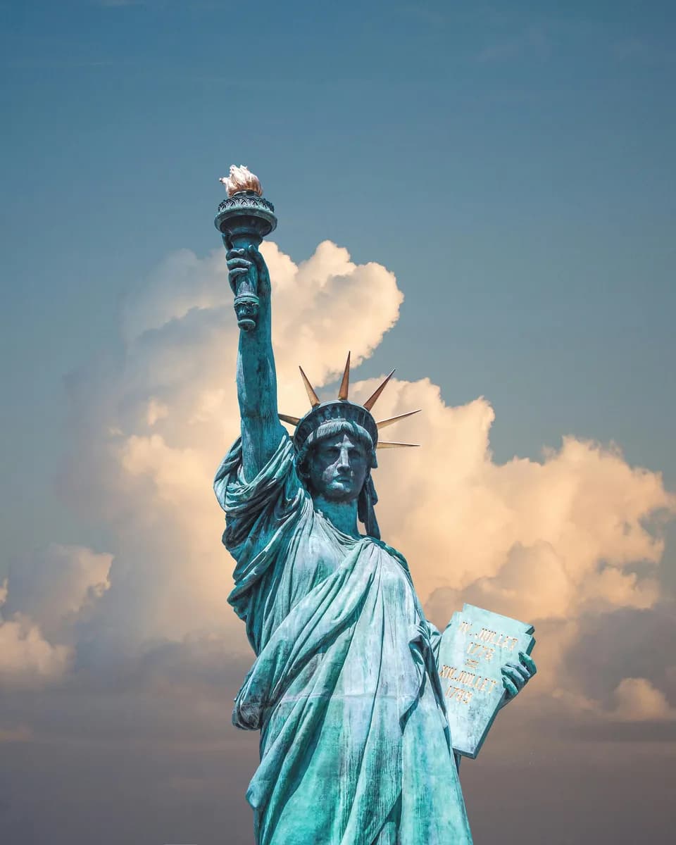 Statue of Liberty against a cloudy sky